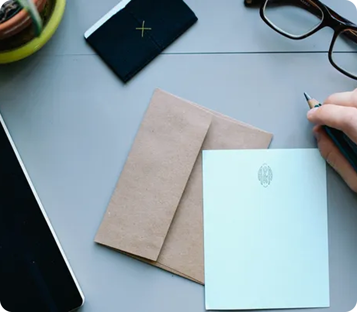 Stationery and glasses on a desk